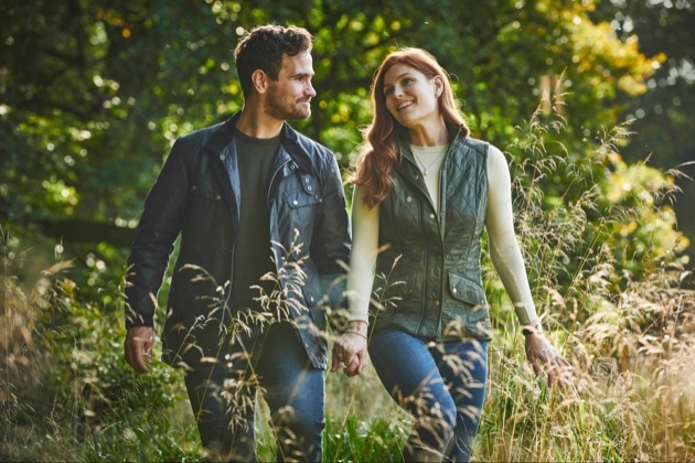 Couple walking in a field