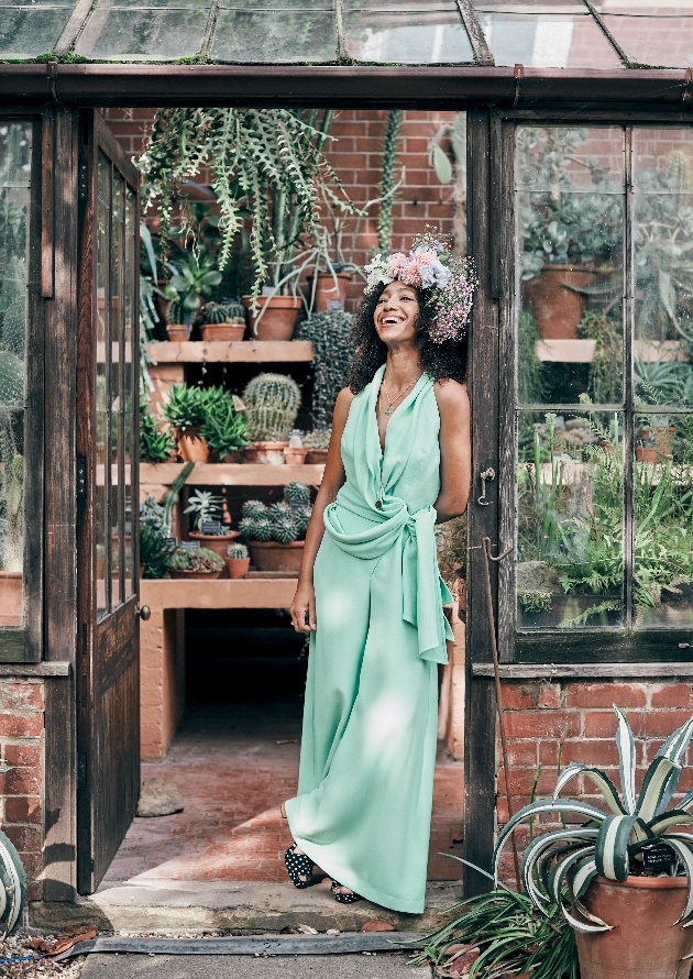 Hazel Gardiner in green dress and wearing flower crown