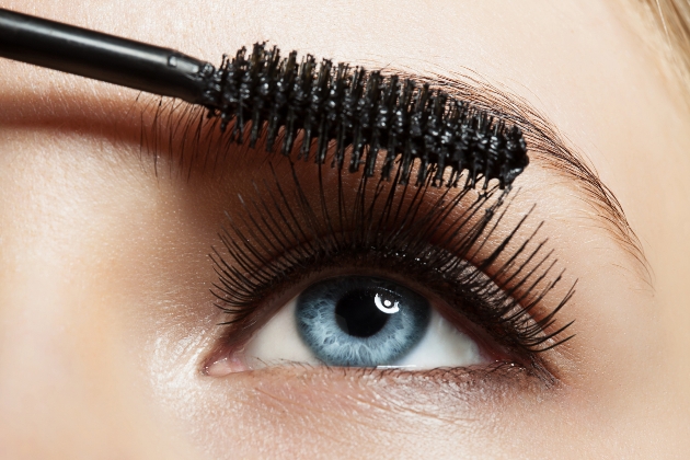 Close-up of make-up blue eye with long lashes with black mascara