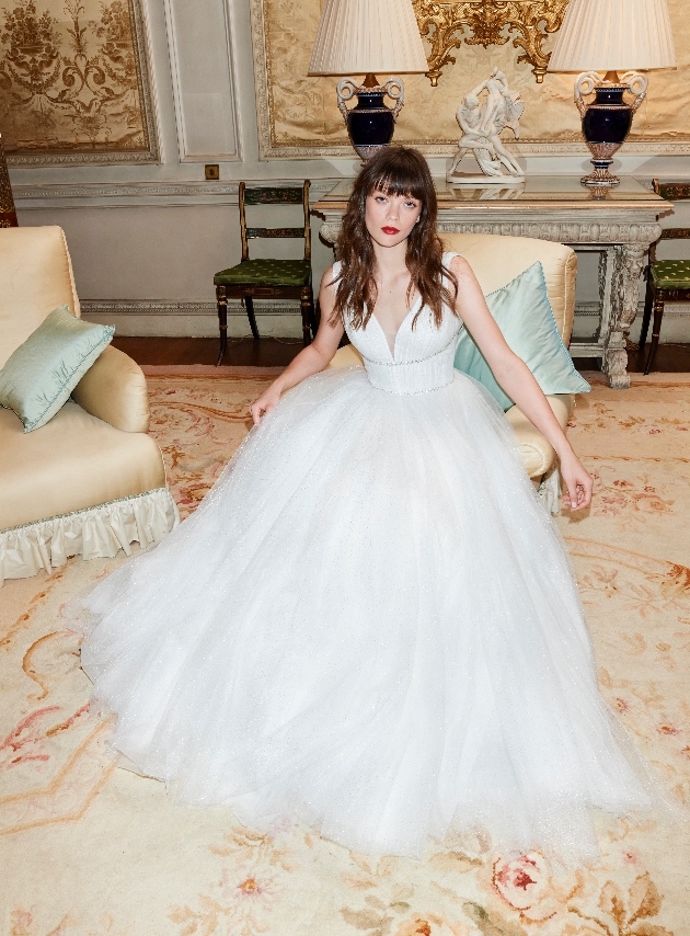 model wearing tulle skirt ballgown cinched at waist 