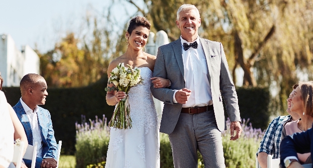 father walking daughter down aisle