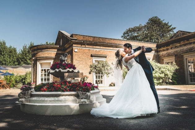 Couple dance in front of De Courceys Manor