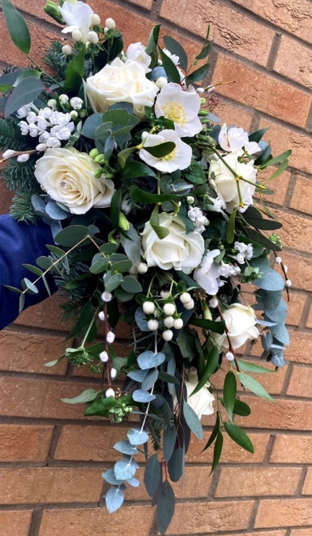 White flower bouquet on brick background