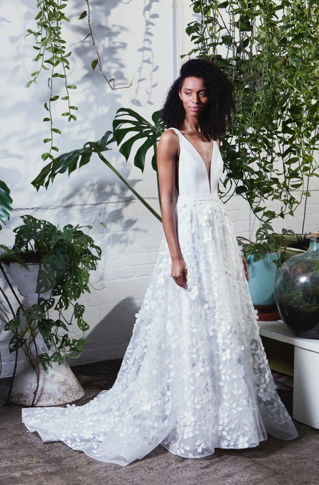 Model wearing floral appliqué dress