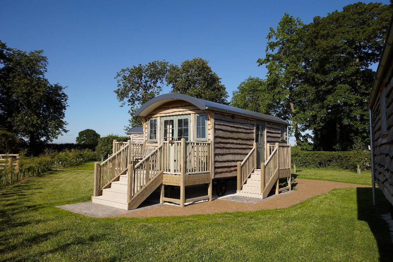 shepherd hut in field