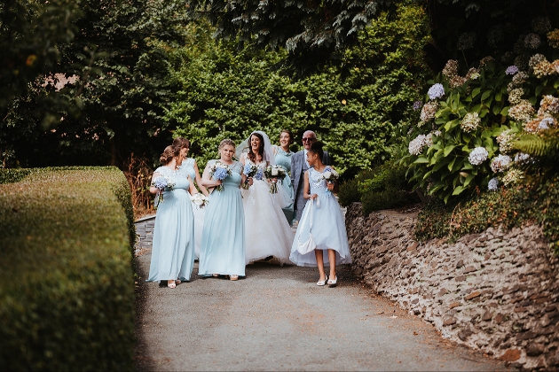 Bridal party walking to church