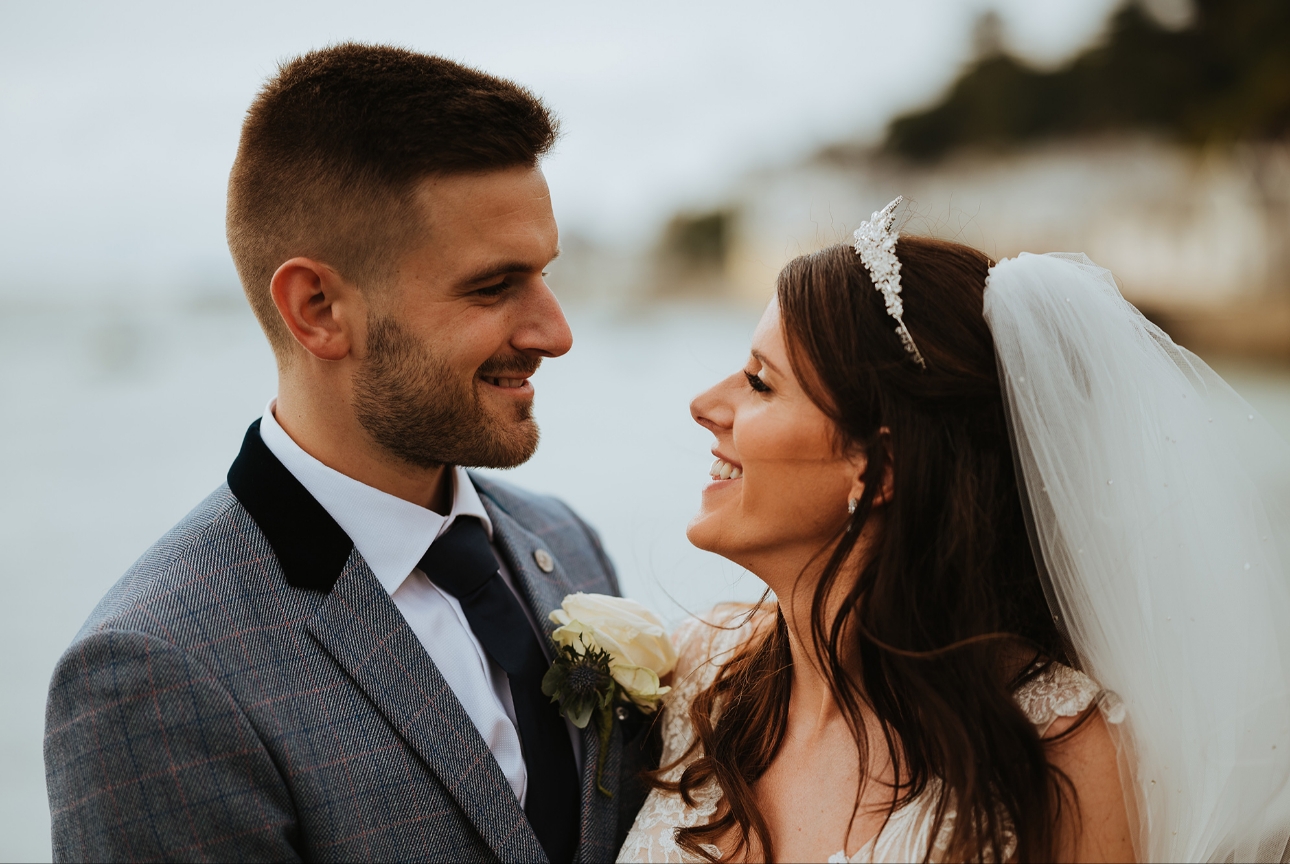 Bride and groom on beach