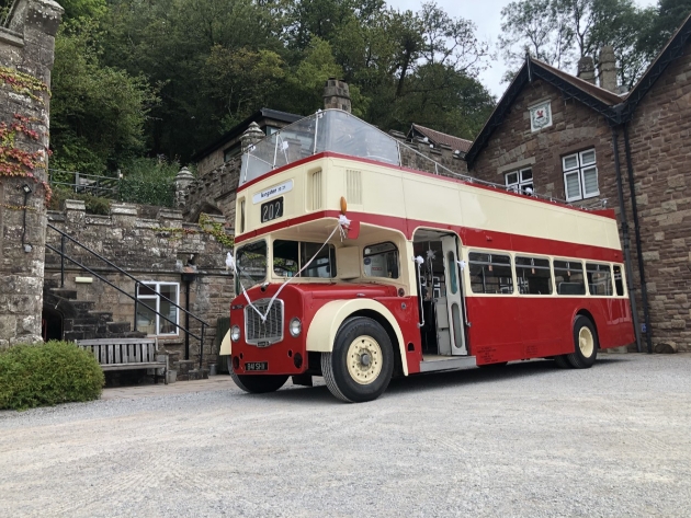 Red and white open top double decker bus