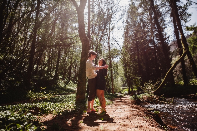 Couple laughing in the woods