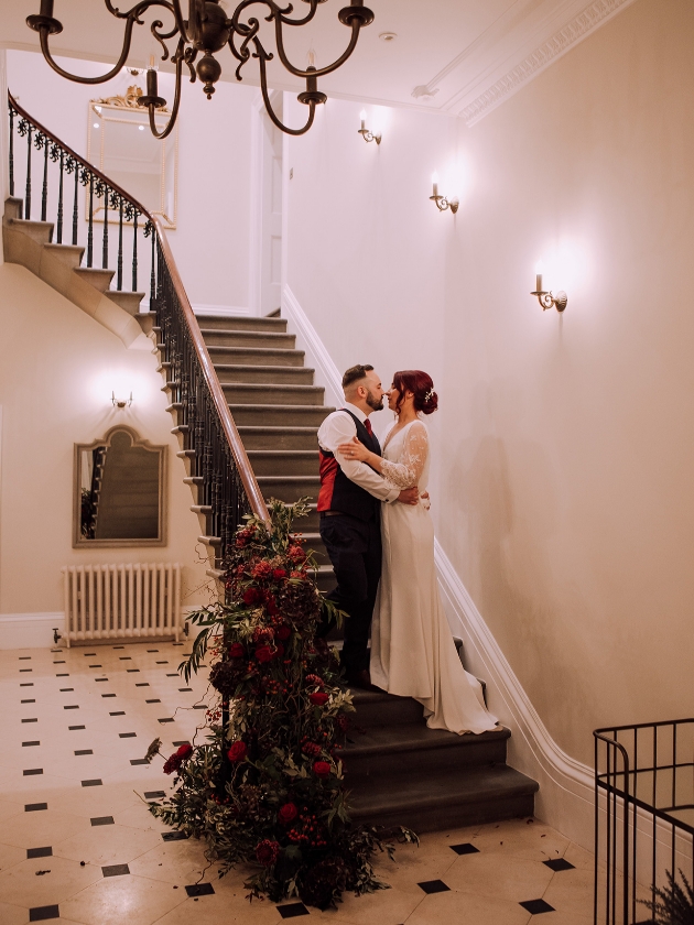 Couple pose on staircase