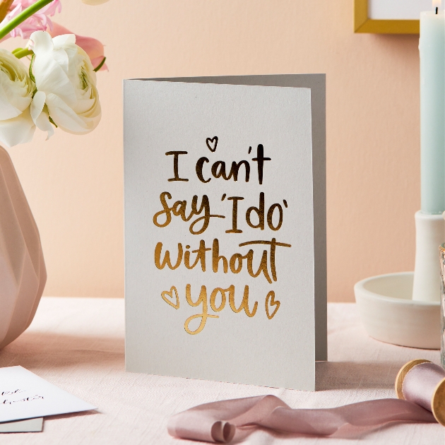 pale pink card with the word I can't say I do without you written on it in gold