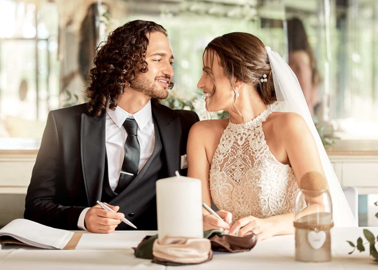 couple signing the register 