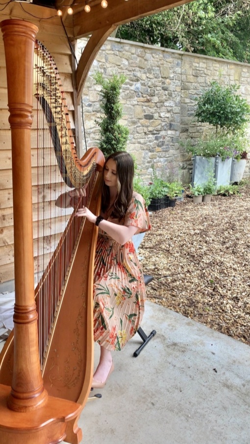 Hannah Williams Harpist playing the harp