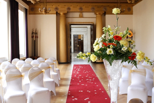 Indoor ceremony set up with a close up of a bouquet of flowers