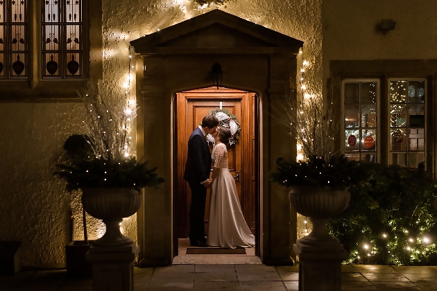 Couple kissing outside Holm House Hotel