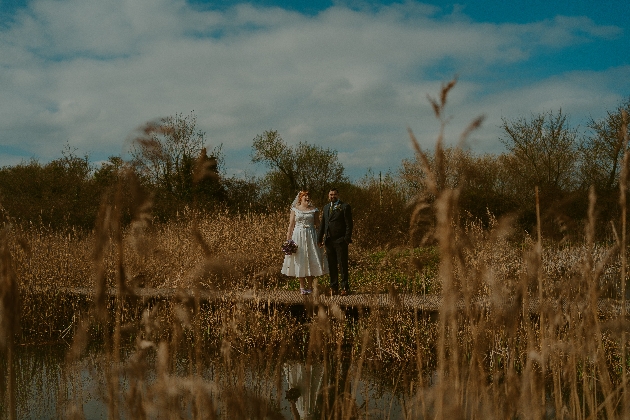 Bride and groom in a field