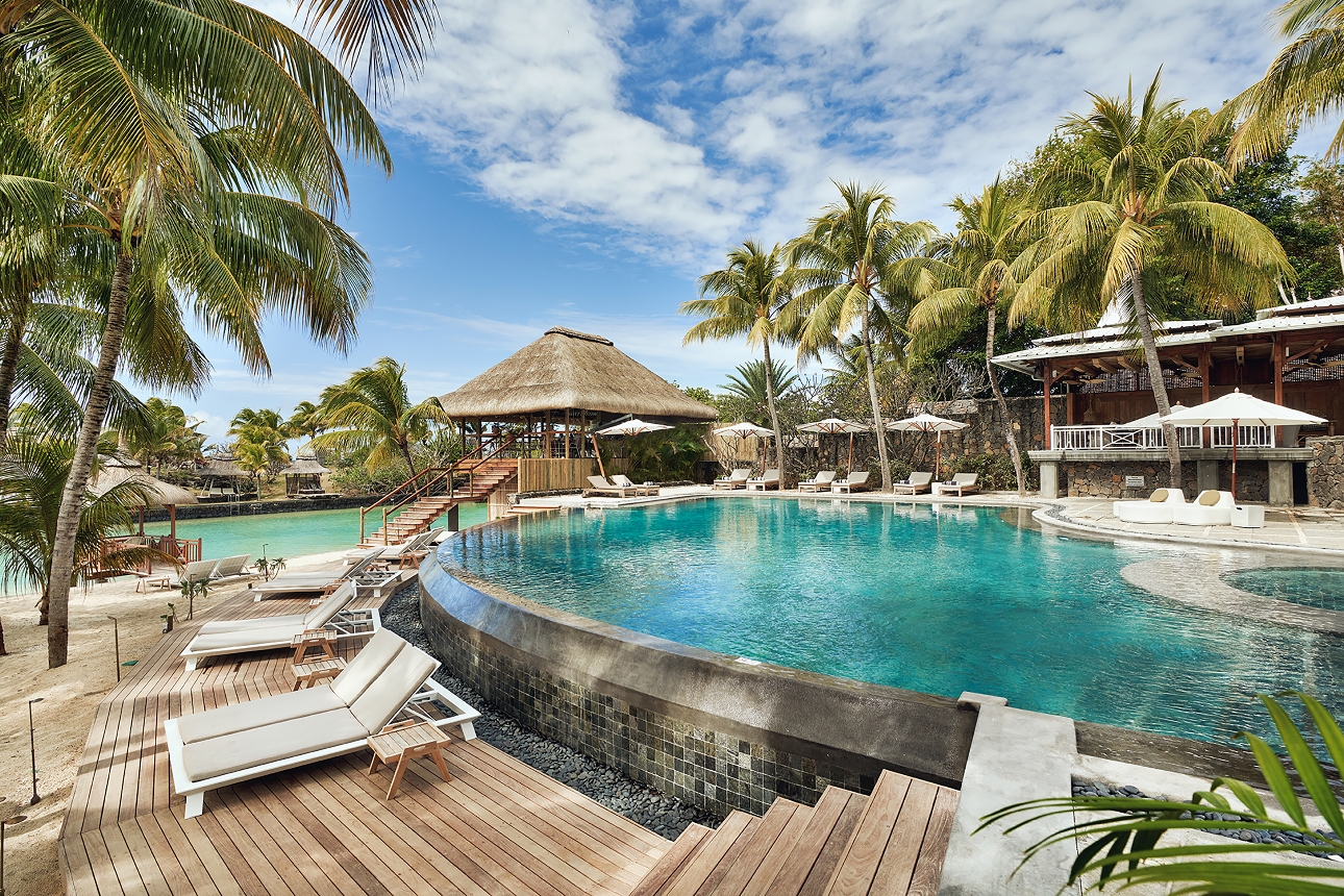 pool area with two pools loungers and decking etc