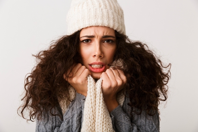 woman in wool hat and looking cold