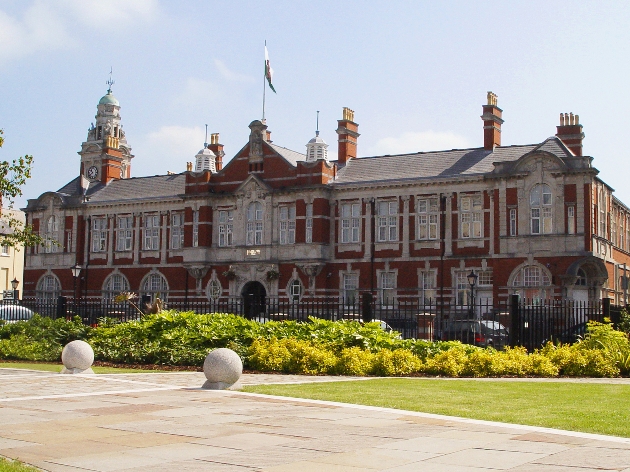 The exterior of a large red and white building