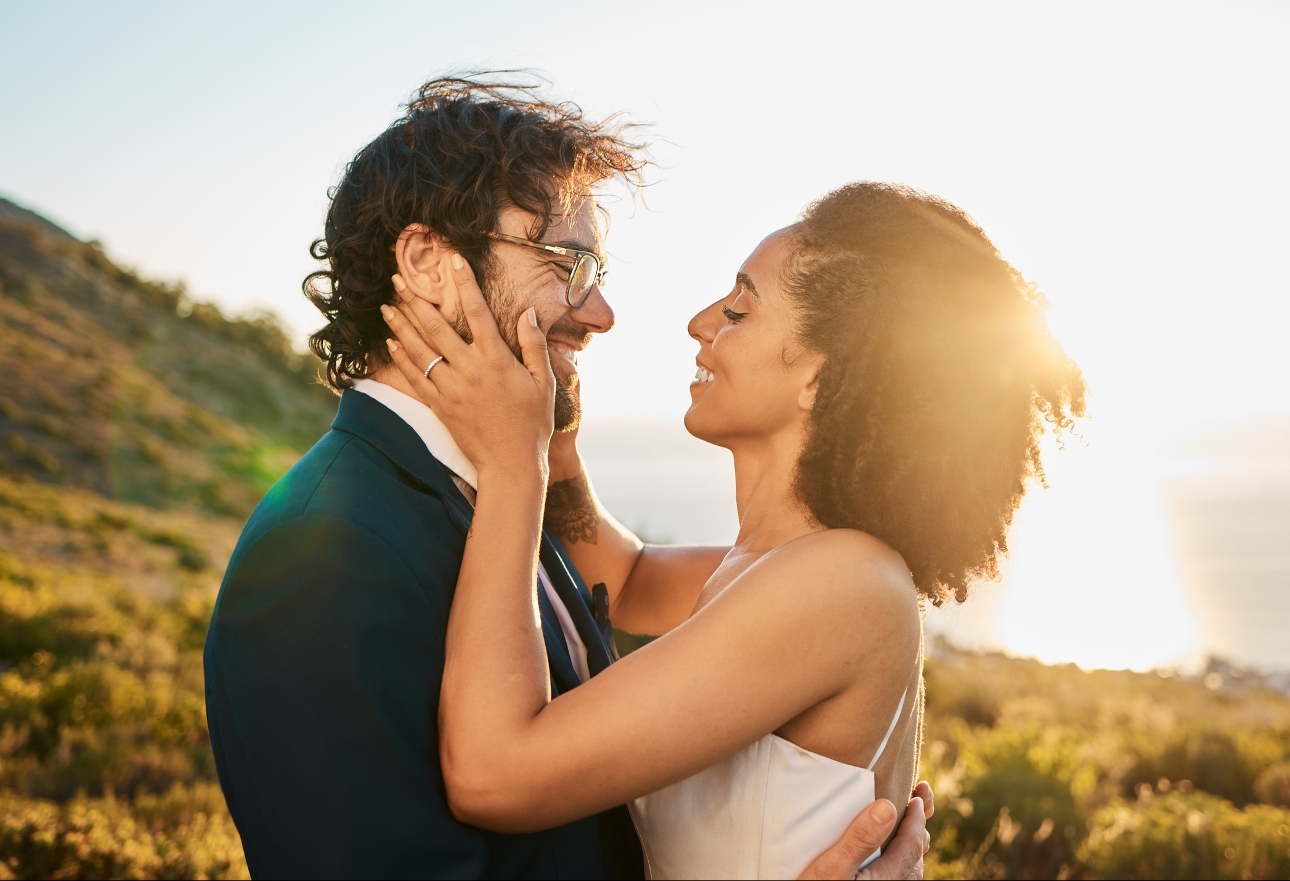 wedding couple embraced at sunset