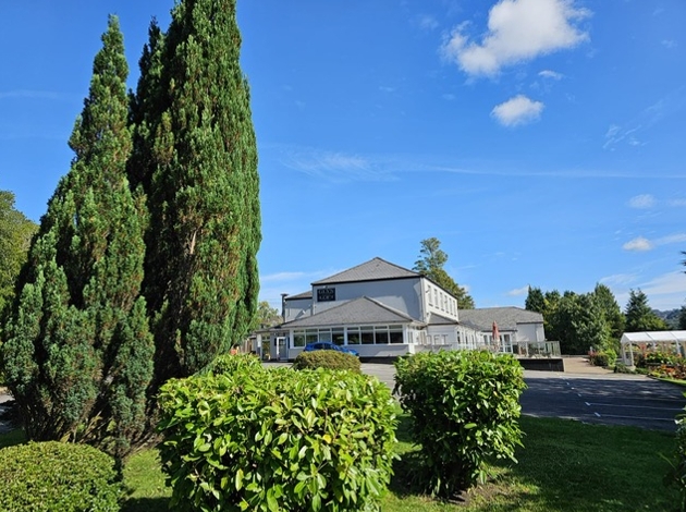 The exterior of a white and grey building