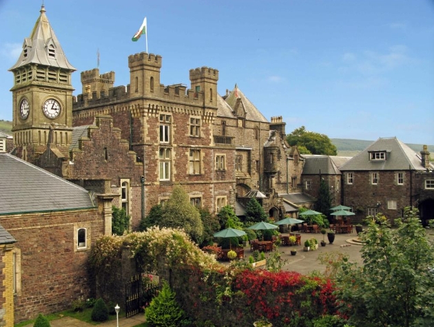 The exterior of a large castle with a clocktower