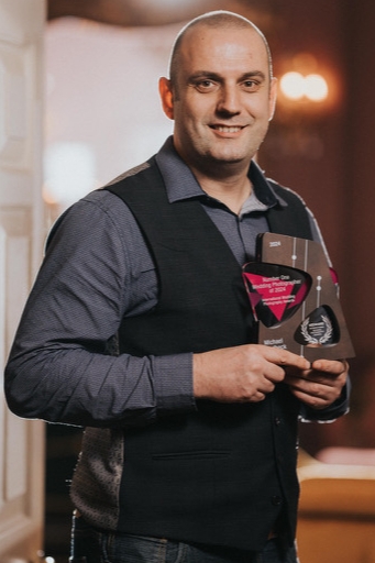 man holding an award
