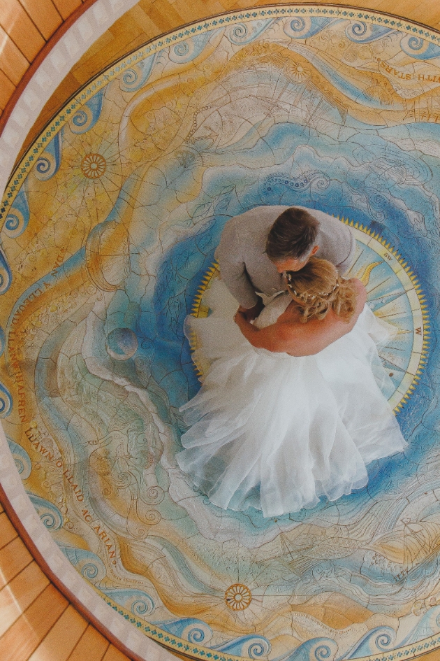 bride and groom embracing 