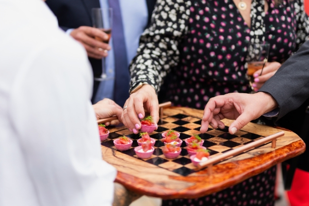 small food on chess board being served to guests