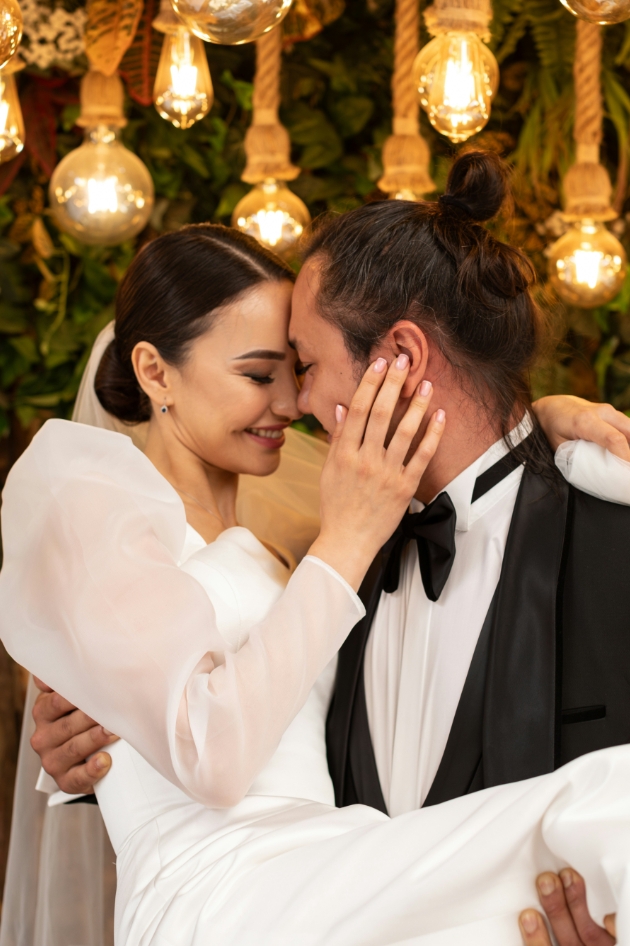 bride and groom embracing