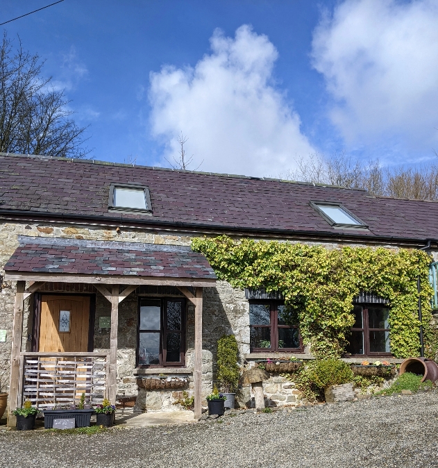 The exterior of a stone cottage