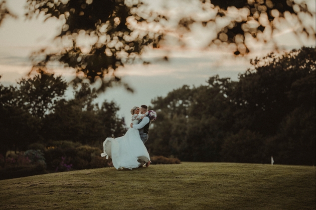 A couple dancing together on a golf course