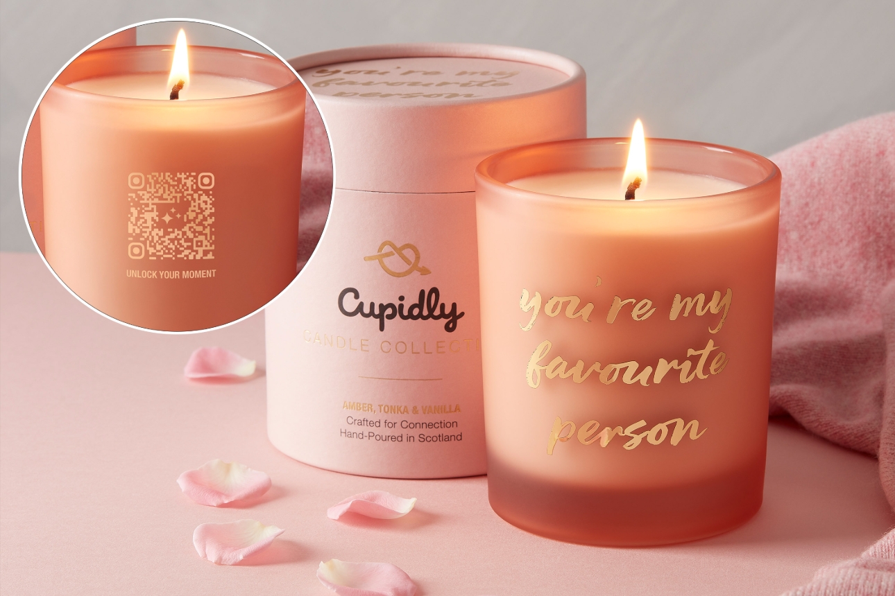 pink candle with a QR code on it