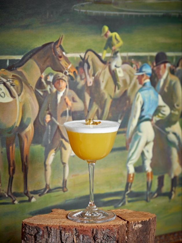cocktail in front of painting