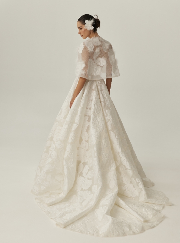A line wedding gown crafted from silk organza with delicate embossed floral motifs