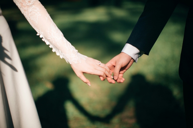 Newly weds holding hands