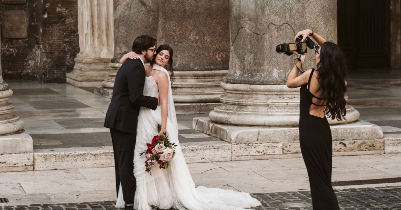 photographer taking picture of couple